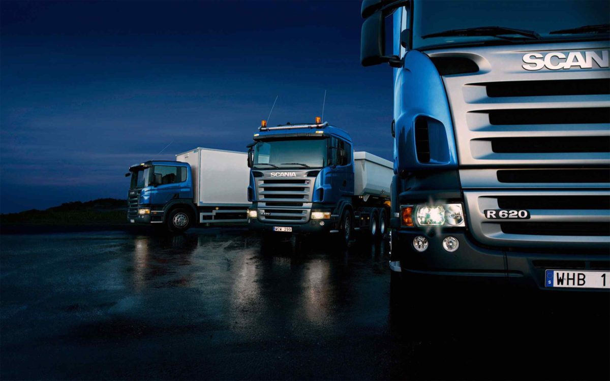 Three-trucks-on-blue-background